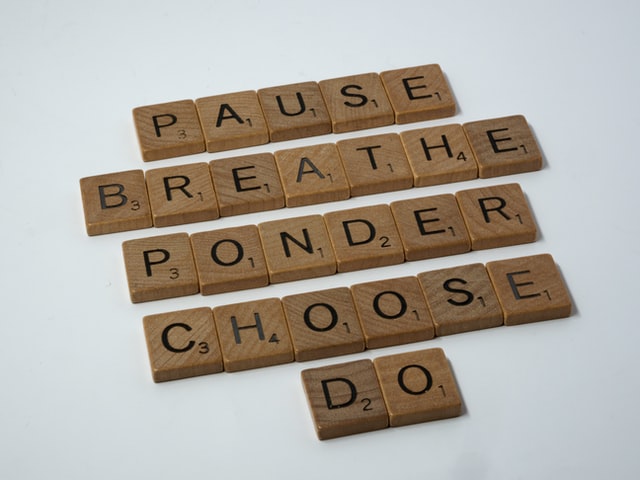 Scrabble blocks that spell &ldquo;Pause, Breathe, Ponder, Choose, Do&rdquo;